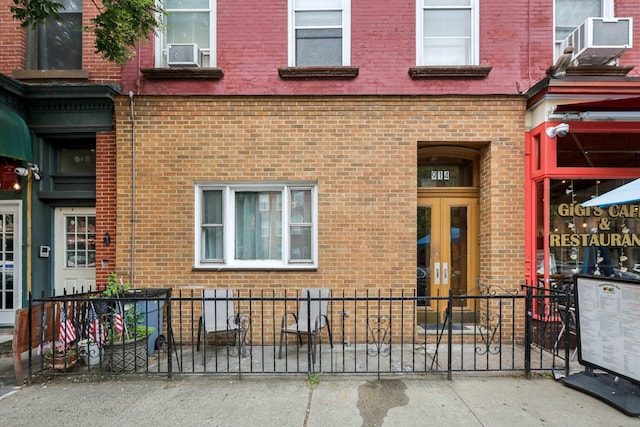 914 Washington St, Hoboken, NJ 07030 - property entrance featuring french doors, brick siding, and cooling unit