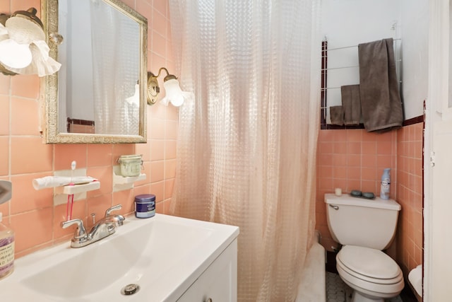 914 Washington St, Hoboken, NJ 07030 - bathroom with tile walls, vanity, curtained shower, and decorative backsplash