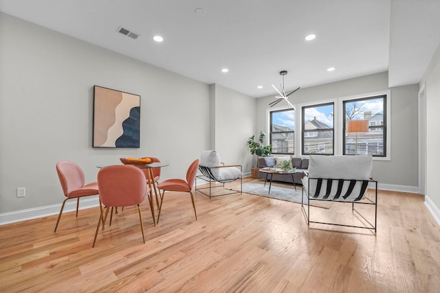 dining room featuring baseboards, recessed lighting, visible vents, and light wood-style floors