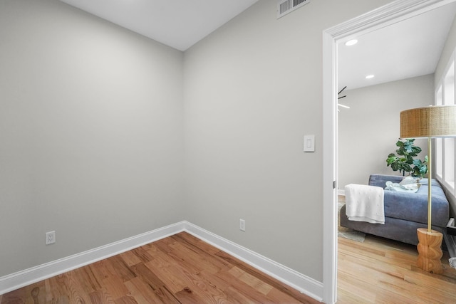 interior space with light wood-style flooring, recessed lighting, baseboards, and visible vents