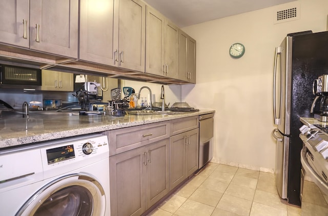 1 Claridge Dr Unit 310, Verona, NJ 07044 - washroom featuring washer / dryer and light tile patterned flooring