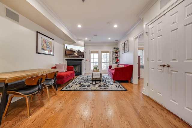 215 Monroe St Unit 3, Hoboken, NJ 07030 - living room featuring ornamental molding, a fireplace, light wood-type flooring, and recessed lighting