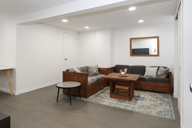 living room featuring recessed lighting, baseboards, and wood finished floors