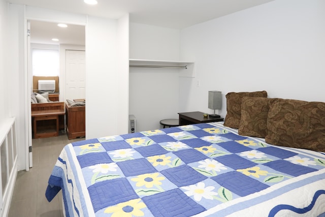 bedroom with light wood-style flooring and recessed lighting