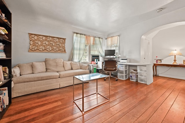 living room featuring hardwood / wood-style flooring and built in desk