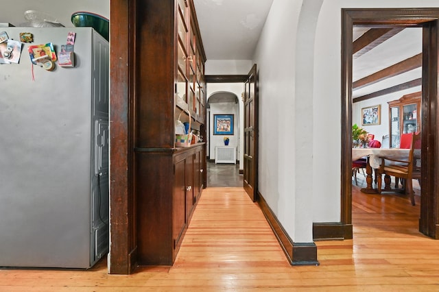 corridor with light wood-type flooring