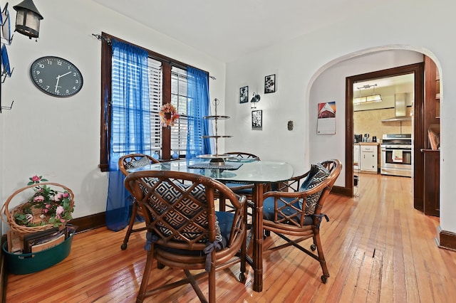 dining area with light hardwood / wood-style floors