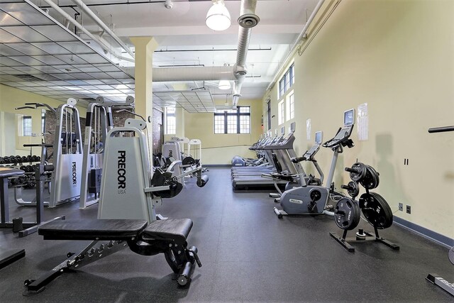 exercise room with baseboards