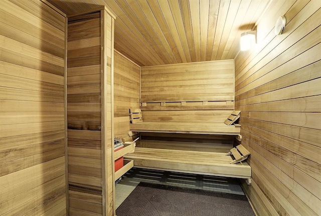 sauna with wooden walls and wooden ceiling