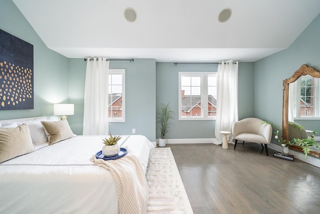 bedroom featuring baseboards and wood finished floors