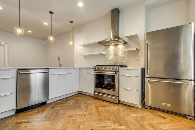 kitchen featuring open shelves, white cabinetry, recessed lighting, appliances with stainless steel finishes, and wall chimney range hood