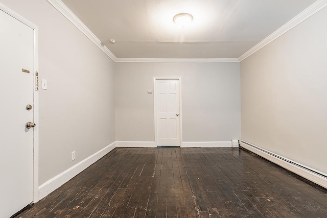 empty room with a baseboard heating unit, crown molding, baseboards, and hardwood / wood-style floors