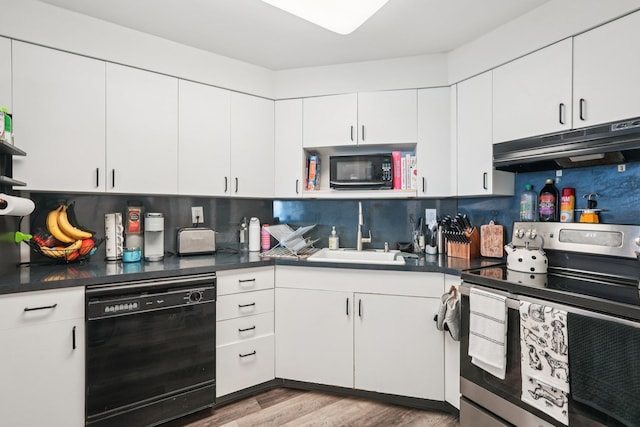 340 Harmon Cove Tower 340, Secaucus, NJ 07094 - kitchen with black appliances, under cabinet range hood, tasteful backsplash, and dark countertops