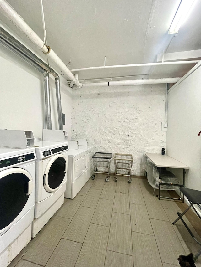315 56th St Unit D4, West New York, NJ 07093 - communal laundry room with washing machine and dryer and wood finished floors
