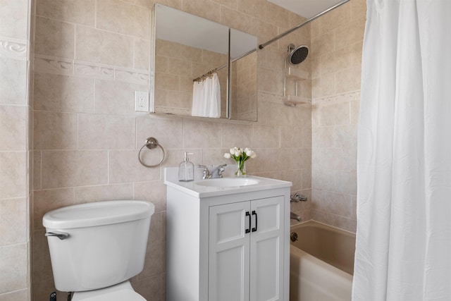 bathroom featuring shower / bath combo, vanity, tile walls, and backsplash