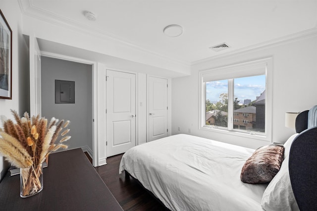 bedroom featuring electric panel, crown molding, and dark hardwood / wood-style floors