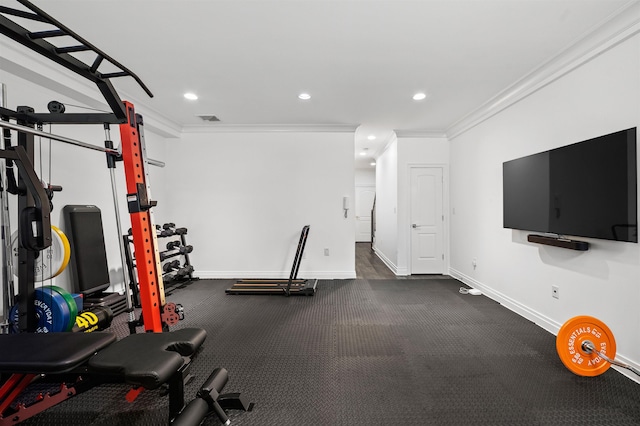 exercise room featuring ornamental molding