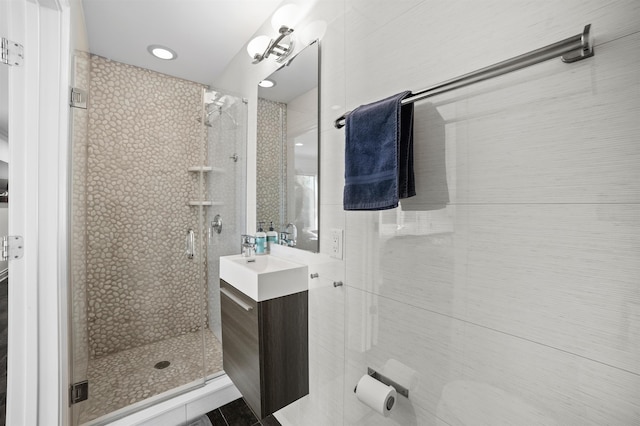 bathroom with vanity and walk in shower