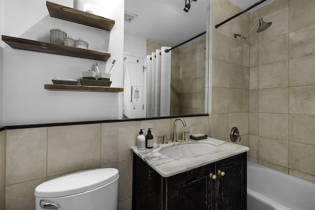139 Morris St Unit 7, Jersey City, NJ 07302 - bathroom featuring tile walls, toilet, vanity, and shower / tub combo with curtain