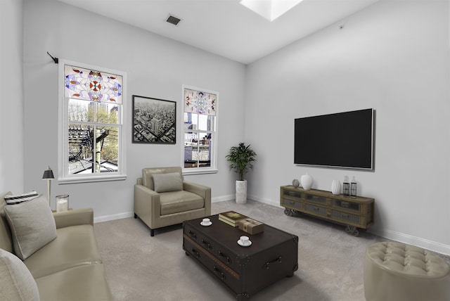 139 Morris St Unit 7, Jersey City, NJ 07302 - living room with a skylight, baseboards, and carpet flooring
