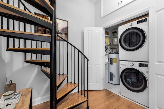 139 Morris St Unit 7, Jersey City, NJ 07302 - laundry room with stacked washer and clothes dryer, electric water heater, and wood finished floors