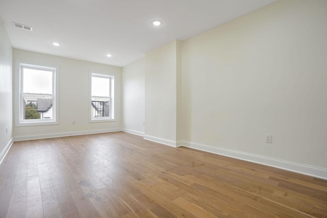 spare room with light wood-type flooring