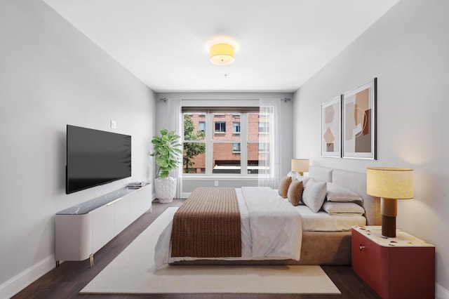 15 Warren St Unit 102, Jersey City, NJ 07032 - bedroom featuring dark wood-style flooring and baseboards
