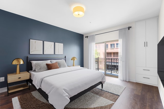 15 Warren St Unit 102, Jersey City, NJ 07032 - bedroom with access to exterior, wood finished floors, and baseboards