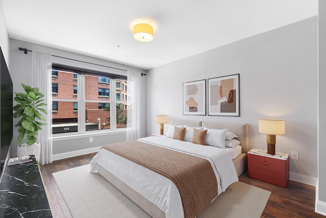 15 Warren St Unit 102, Jersey City, NJ 07032 - bedroom with wood finished floors and baseboards