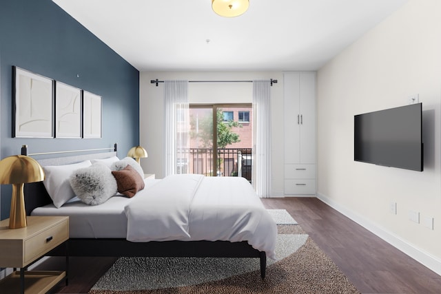 15 Warren St Unit 102, Jersey City, NJ 07032 - bedroom featuring dark wood finished floors, access to outside, and baseboards