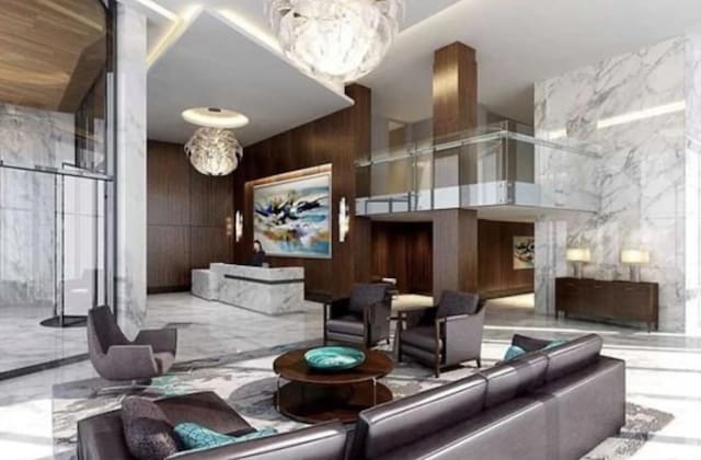 800 Ave At Port Imperial Unit 323, Weehawken, NJ 07086 - lobby with wooden walls and a towering ceiling