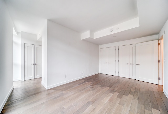 800 Ave At Port Imperial Unit 323, Weehawken, NJ 07086 - unfurnished bedroom with two closets and light wood-style floors