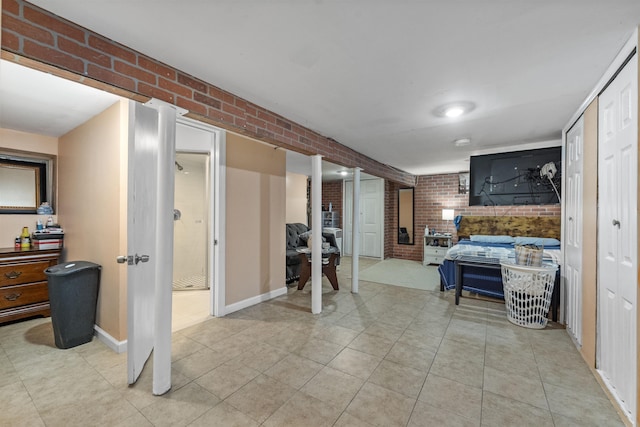 1501 41st St, North Bergen, NJ 07047 - living area featuring brick wall and light tile patterned floors