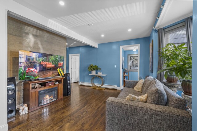 1501 41st St, North Bergen, NJ 07047 - living area featuring baseboard heating, wood finished floors, a glass covered fireplace, recessed lighting, and an accent wall