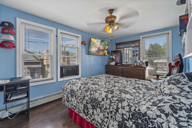 1501 41st St, North Bergen, NJ 07047 - bedroom featuring cooling unit, a baseboard heating unit, dark wood-style flooring, and a ceiling fan