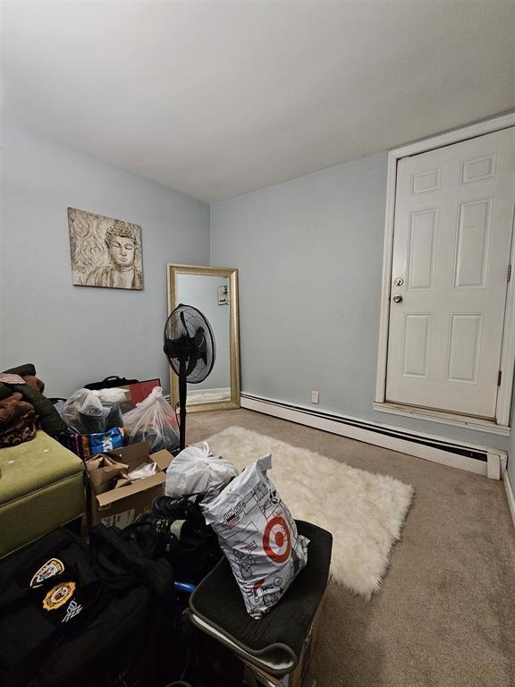 interior space featuring baseboards and baseboard heating