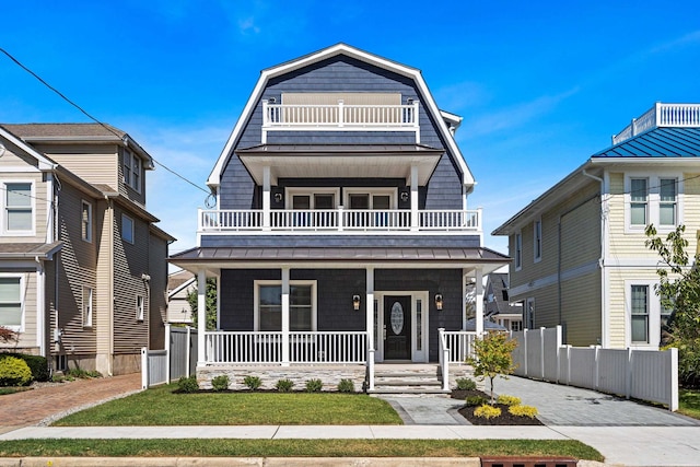 view of front facade featuring a porch and a balcony