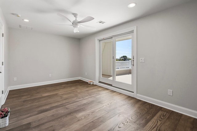 spare room featuring hardwood / wood-style floors and ceiling fan