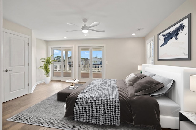 bedroom featuring hardwood / wood-style floors, ceiling fan, and access to exterior