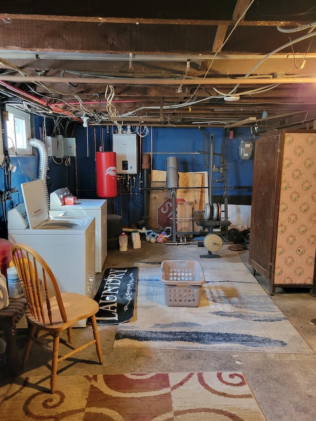 basement with water heater and washer and clothes dryer
