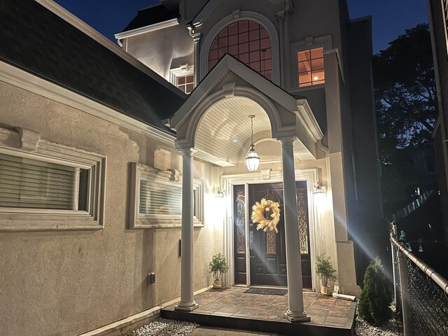 25 Poplar St, Jersey City, NJ 07307 - exterior entry at night featuring stucco siding and a porch