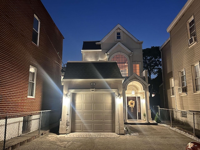25 Poplar St, Jersey City, NJ 07307 - view of front of house with concrete driveway, an attached garage, cooling unit, and roof with shingles