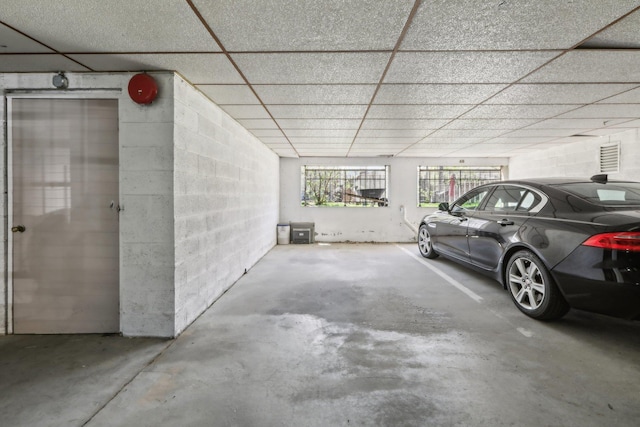 parking deck featuring concrete block wall