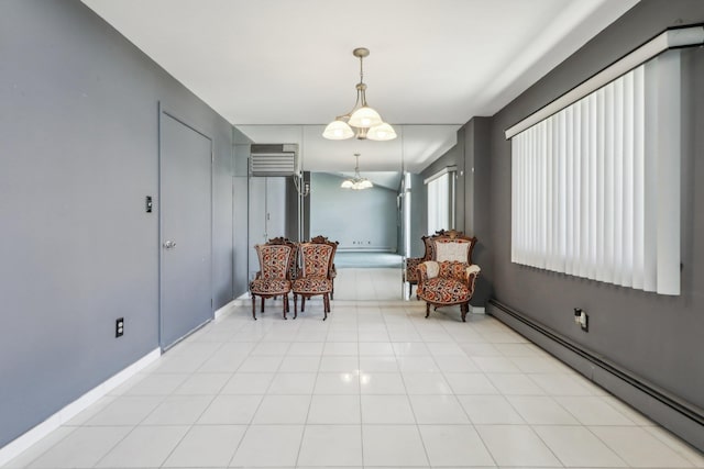 sitting room featuring baseboard heating and a wall mounted air conditioner