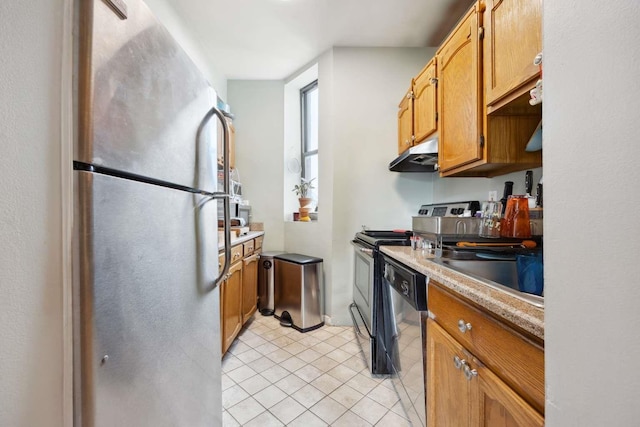 kitchen with under cabinet range hood, light countertops, light tile patterned floors, appliances with stainless steel finishes, and brown cabinetry