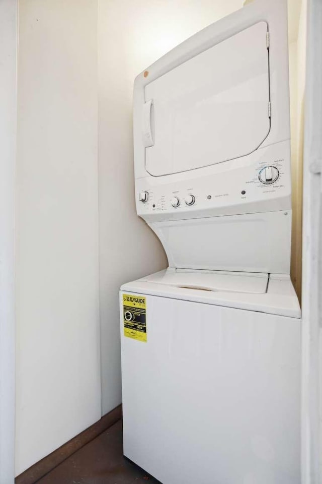 washroom with laundry area and stacked washer and clothes dryer