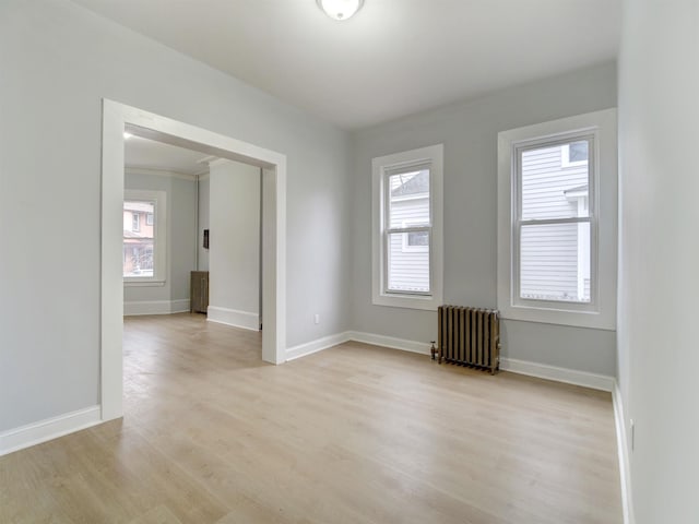 33 Duer Pl, Weehawken, NJ 07086 - unfurnished room featuring radiator heating unit and light wood-type flooring