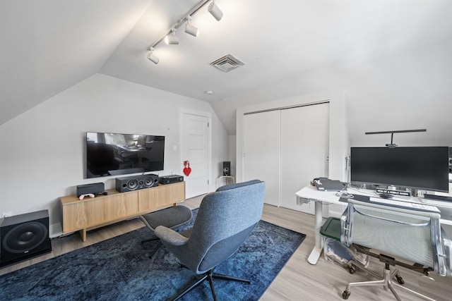 33 Duer Pl, Weehawken, NJ 07086 - home office featuring lofted ceiling, wood finished floors, and track lighting
