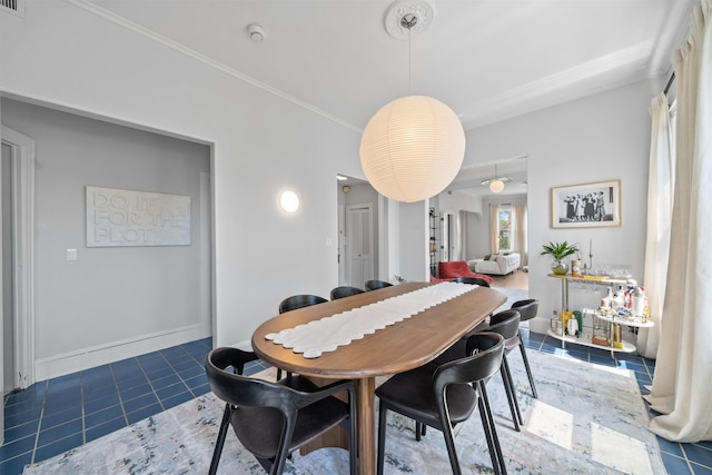 33 Duer Pl, Weehawken, NJ 07086 - tiled dining space featuring crown molding and baseboards