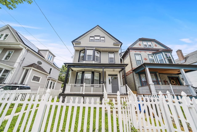 33 Duer Pl, Weehawken, NJ 07086 - victorian-style house with a porch and a fenced front yard